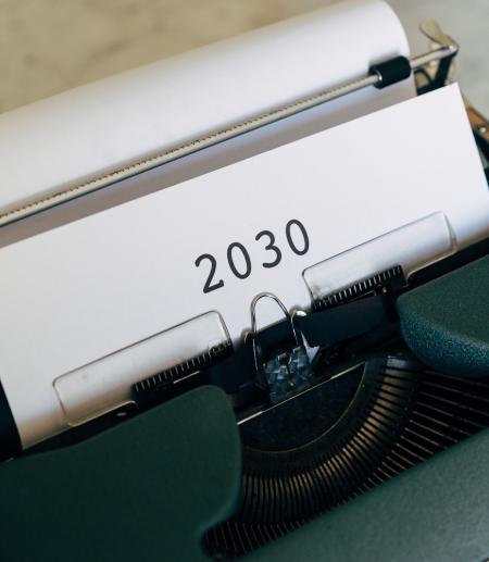 Typewriter with sheet of paper saying 2030