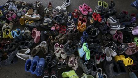 Large pile of children's shoes
