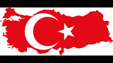 Flag of Turkey in the shape of Turkey, red lackground with white crescent moon and star
